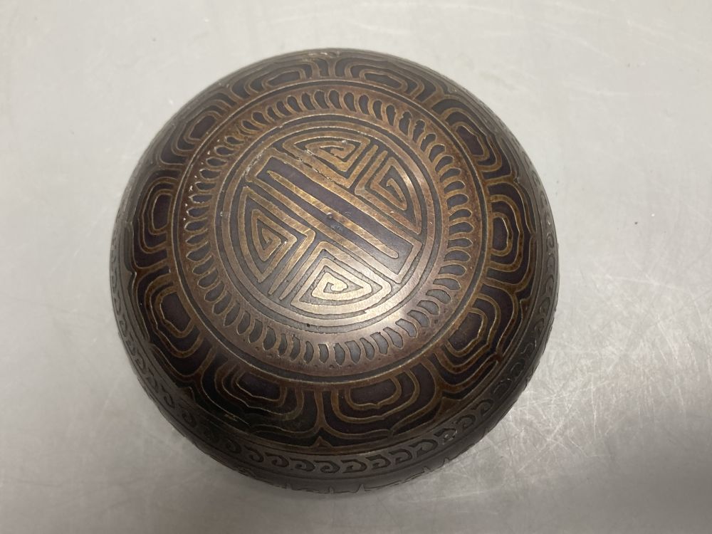 An Islamic small bronze circular bowl, with engraved decoration and Arabic script, Dia 11cm